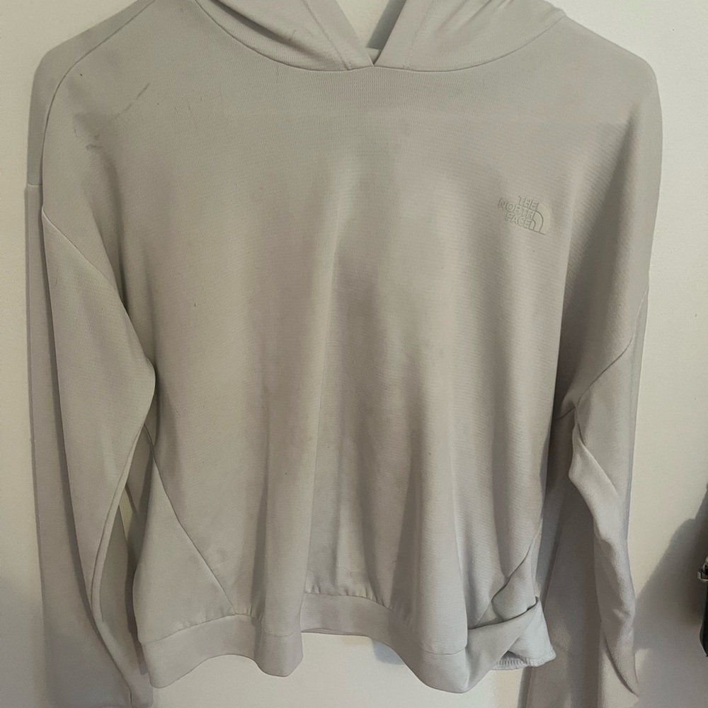 White/Cream, north face, hoodie/long sleeve. Small stain on front, not very big.